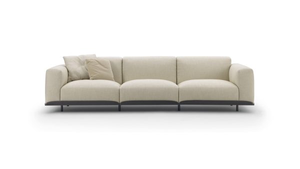 The Arflex Claudine L Sofa by Claesson Koivisto Rune is elegant, innovative with a hint of playfulness. Shown in beige fabric - Front View