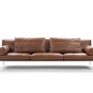 The innovative and delightful Happy Sofa designed by Antonio Citterio for Flexform. Elegant metal legs support the plump cushions and beguiling bolster. The sofa here is shown in a tan leather - Front View