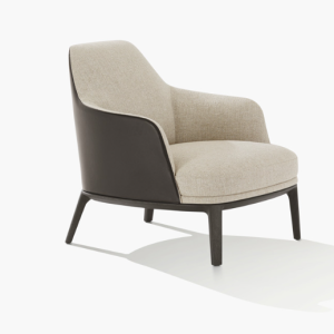 The Jane Large Armchair by Emmaneul Gallina for Poliform, is a sensuous sweep of harmonious proportions and generous volumes. Elegant contrasting tones of leather and fabric higlights the curves of the chair - Side View.