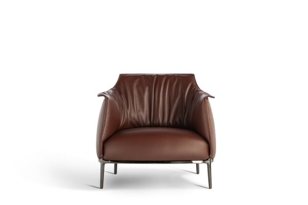 The Archibald armchair, designed by Jean-Marie Massaud for Poltrona Frau, has a silhouette that evokes the delicate grace of a tulip, inviting one to sink into its welcoming embrace. The brown leather upholstery, with its subtle wave-like texture created by vertical pleats, is further adorned with contrasting stitching along the edges. - Front VIew