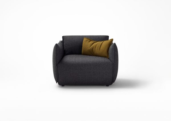The Hearth Armchair by Ross Gardam is the epitome of comfort and style, designed to be the new heart of your home. The slightly upturned edges of the armchair upholstery are a unique design feature that adds a refined artistic flair - Front view in Navy Fabric.